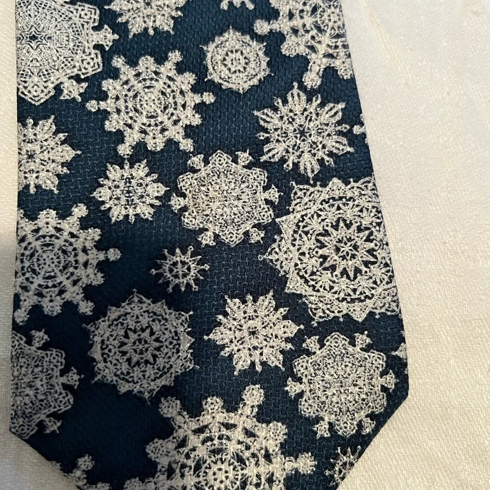 The Museum of Fine Arts, Boston tie in snowflakes. Teal and white.